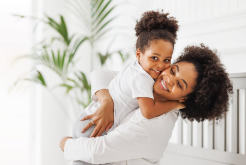 woman and girls smilling