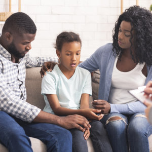 a family talking to their counselor