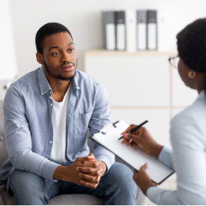 a man talking to a woman counselor