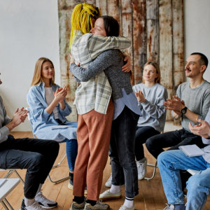 group of people clapping in two people